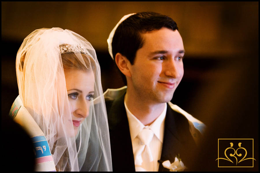 Rina and Jeffrey wrapped in a "Tallit" during their wedding ceremony. Rina and Jeffrey wrapped in a tallit during their wedding ceremony.