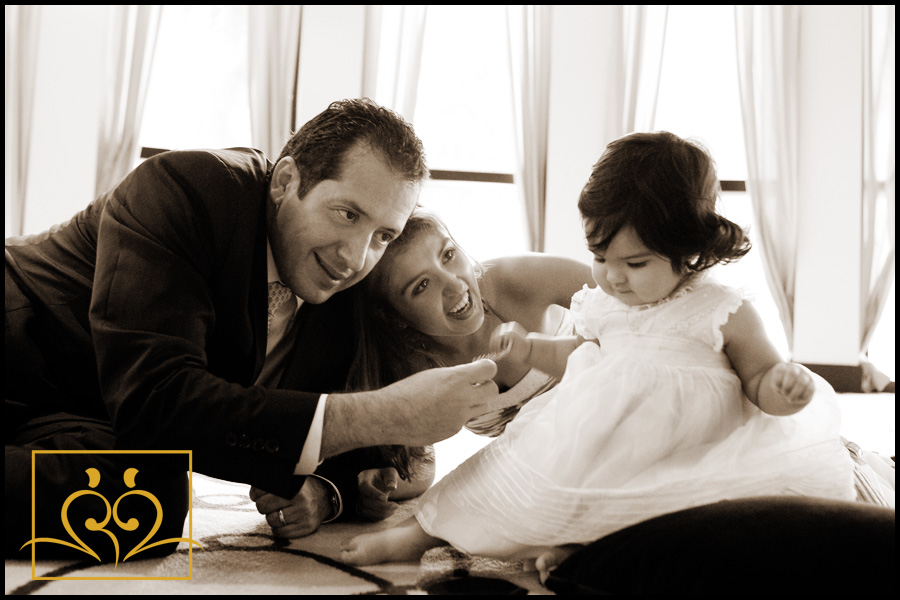 Miami Family Portrait photography Mommmy and daddy share a playful moment.