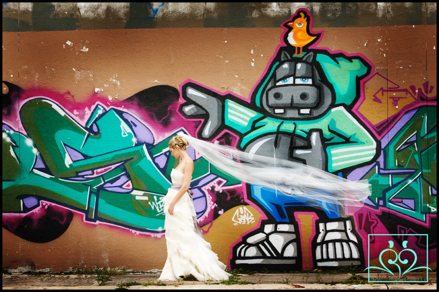 Ft Lauderdale Wedding Photography What a great contrast with Alma in a exquisite Vera Wang wedding gown and some great grafiti.