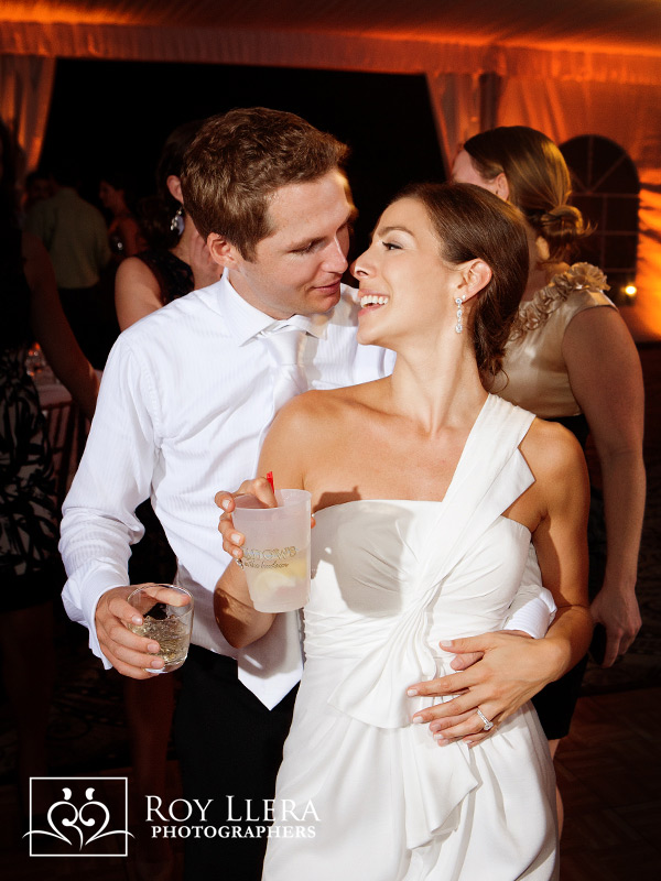 Bride and Groom happily dancing at reception