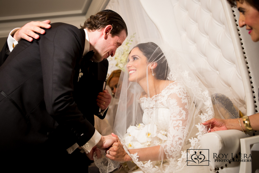 Jewish Wedding Tradiyions as Groom greets his Bride at the Bedeken