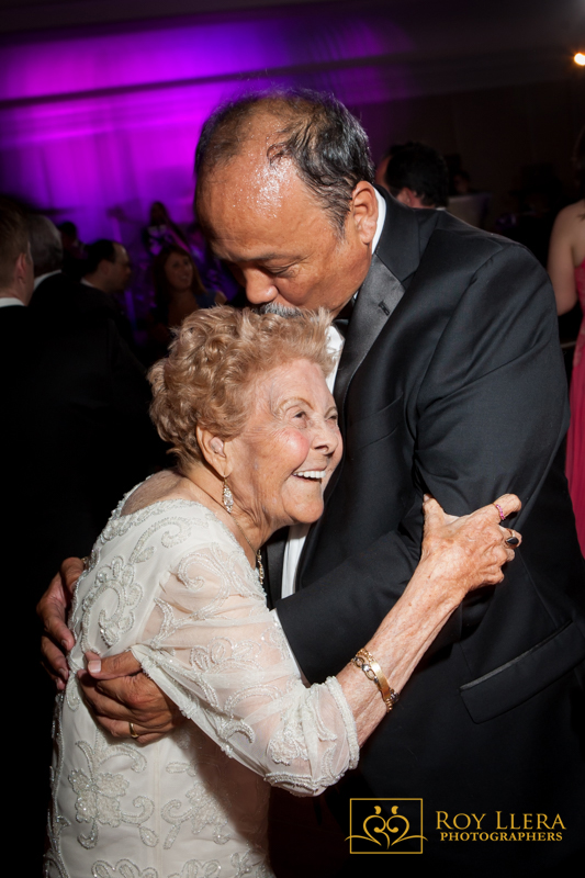 A father of the Bride having a moment with his Mother